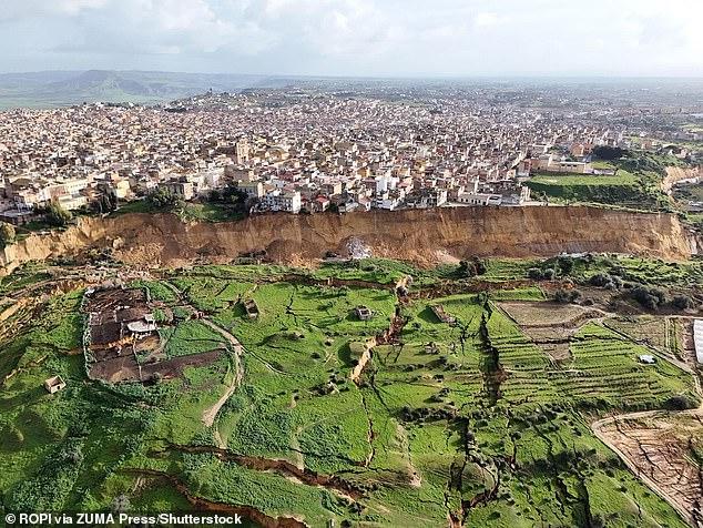 New images show incredible devastation to hit Sicilian town after landslide left houses perched on cliff edge, forcing 1,500 people to evacuate