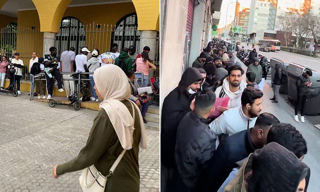 Chaos as five-hour queue of migrants trigger 'collapse' at Spanish registry offices after socialist PM granted residency to 500,000 people