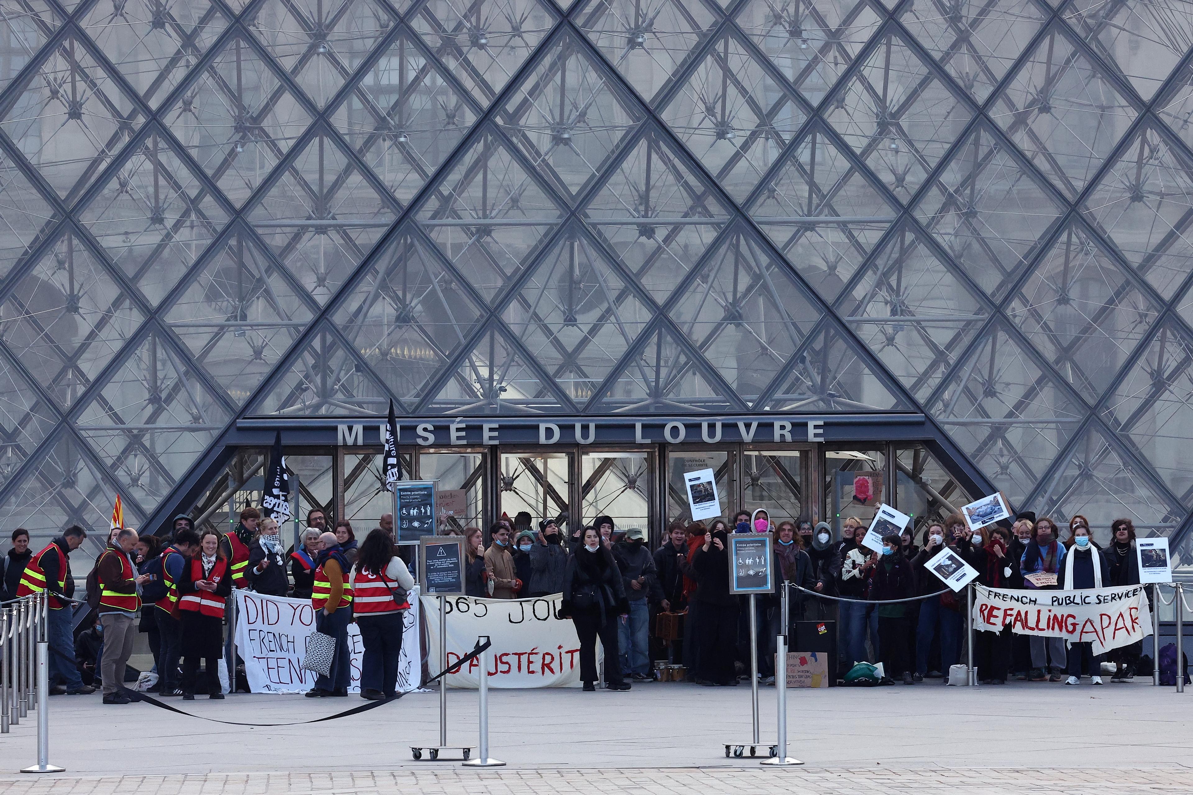 Paris and other cities in France impose curfews amid a month-long wave of protests