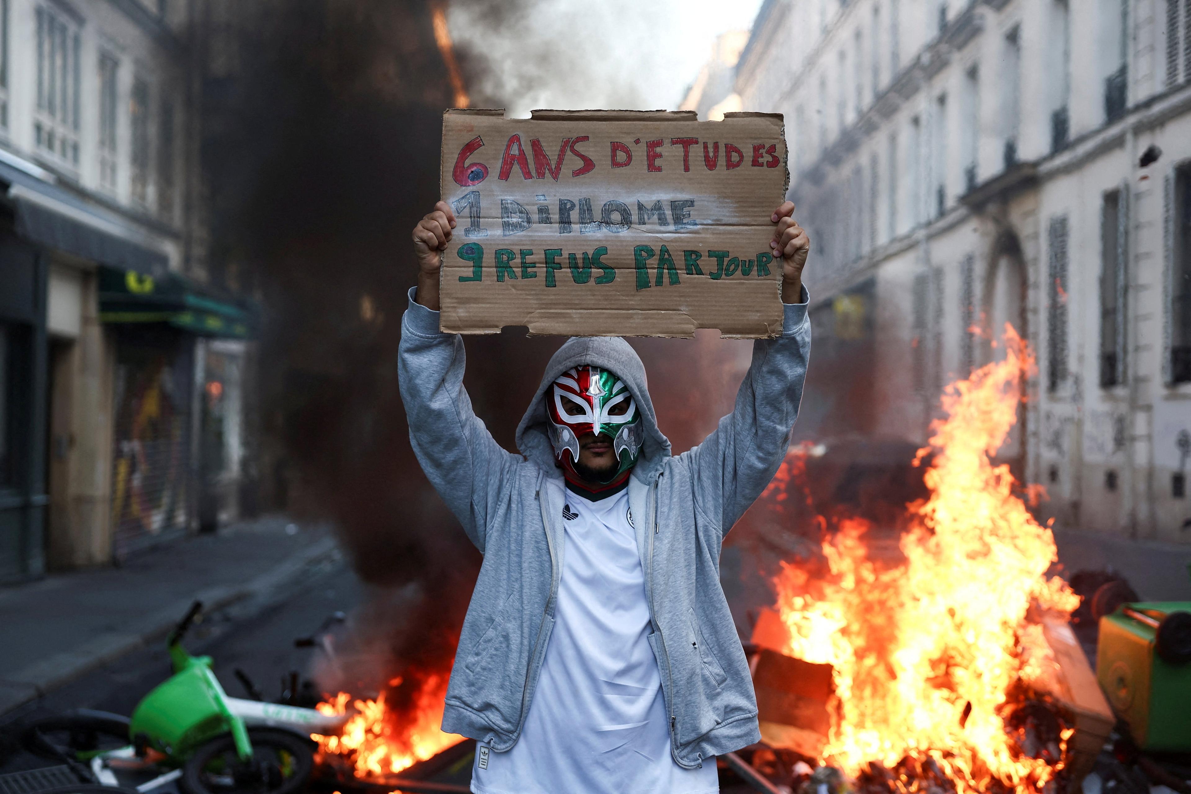 France imposes curfew to curb violent protests